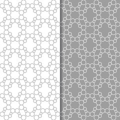 Gray and white geometric ornaments. Set of seamless patterns