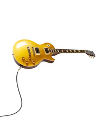 Vintage Gold top electric solid body guitar plugged in, isolated on white. Single cutaway.