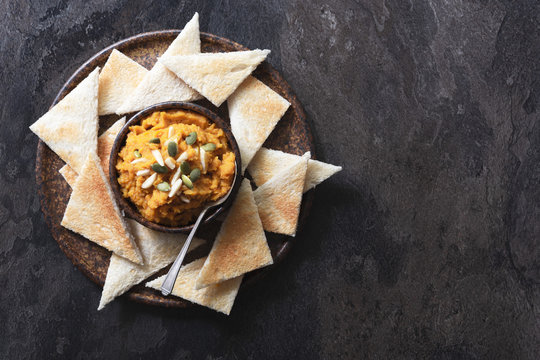 Roasted pumpkin dip with toast triangles.