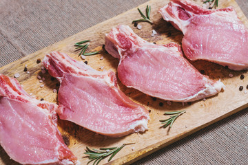 Marinated pieces of pork loin on the bone are ready for frying