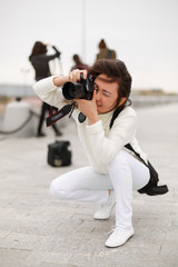 Woman photographer taking picture