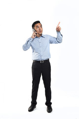Asian man talking over phone while poiting