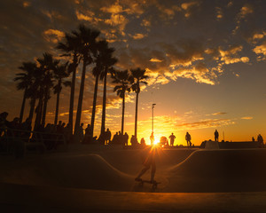Man skateboarding in park during sunset