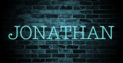 first name Jonathan in blue neon on brick wall