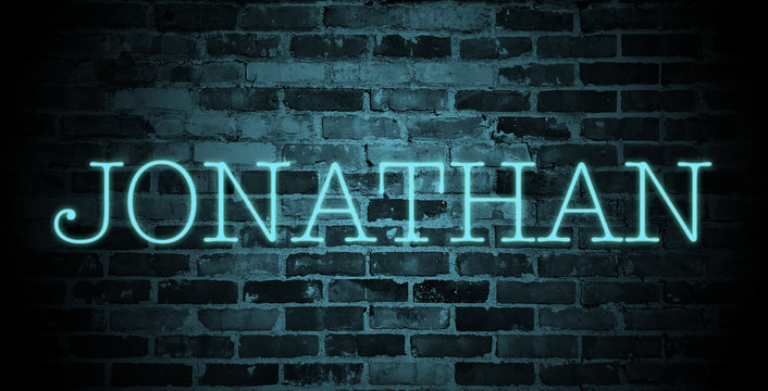 first name Jonathan in blue neon on brick wall