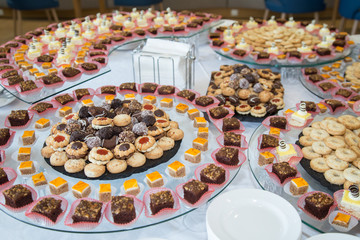 Delicious decorated candy bar, sweets on a buffet table at a luxury event or celebration. Catering food