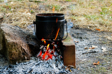 Cooking on campfire in camping