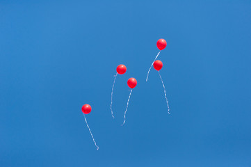 red balls in the blue sky