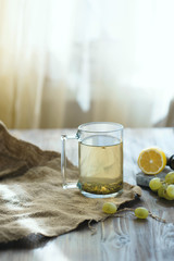 A mug of tea with lemon on the table. Morning concept