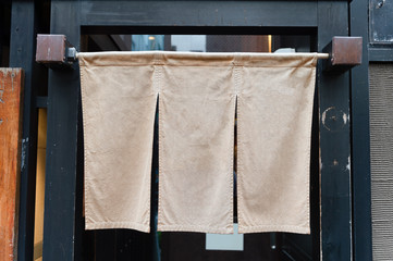 The curtain-like fabric that hangs in front of traditional Japanese restaurants and shops not only serves as a signboard, but holds a larger meaning,