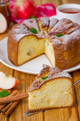 Delicious apple pie with cinnamon and caramel sauce. Traditional cake Charlotte.