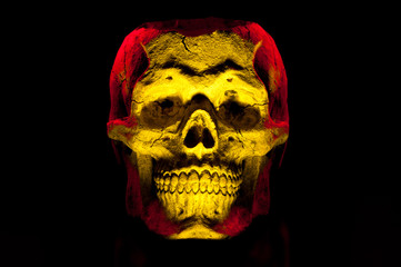 Ceramic skulls on black background. Halloween decor.