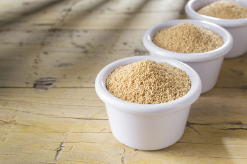 amaranth beans in bowl, on rustic wooden background