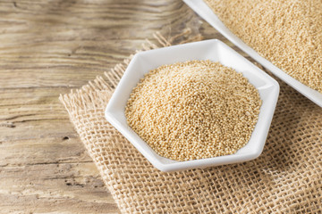 amaranth beans in bowl, on rustic wooden background