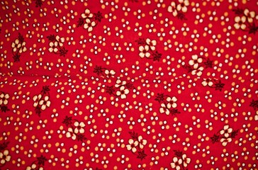 Fragment of colorful retro tapestry text. Fabric striped, flowered texture.