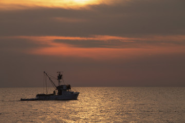 Obraz premium Fishing boat at beautiful sunset , Croatia