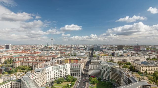 Berlin city skyline. Panoramic view from Potsdamer Platz. White clouds move across the blue sky. Time lapse video.