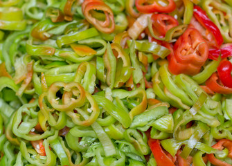 Colorful peppers on rustic wooden table, top view