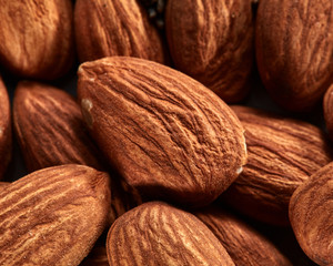 Organic texture of almonds. View from above. Almonds macro background. Almond nuts with soft focus.