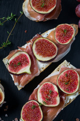 whole bread with cheese, parma ham and figs