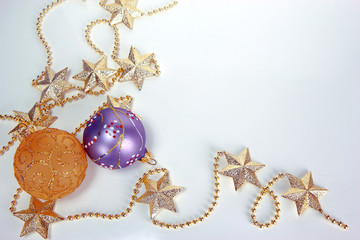 Colorful Christmas glass balls and golden necklace. Christmas and New Year holiday background concept. Blank space for text.