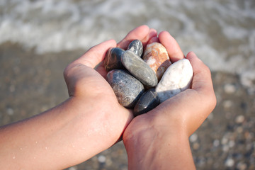 beach pebbles in the palm of your hand