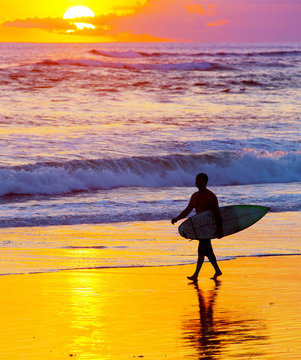 Surfer at sunset. Bali island