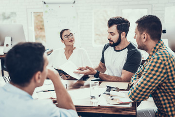 Young Workers Have Discussion in Modern Office.