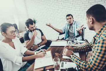 Young Workers Have Discussion in Modern Office.