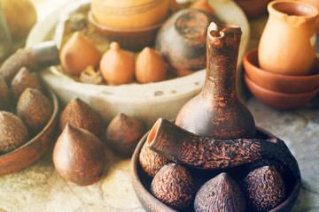 Georgian clay traditional decorative jugs kvevri for wine. Pottery on a table.