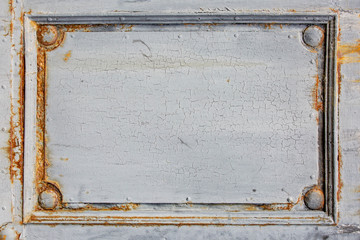 Fragment of an old wooden door. Background for a design of a saturated gray color