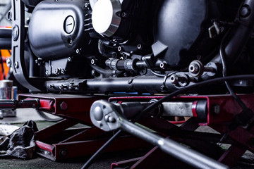 Cropped close up shot of beautiful and custom made motorcycle in the workshop