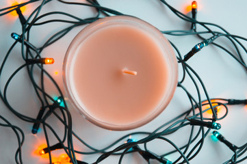 Close up of aromatic candle and garland