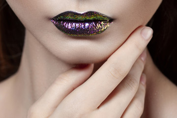 Naklejka premium Young beautiful girl with purple make-up