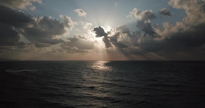 Shot of a beautiful summer sunset at the beach. Sunset at sea drone footage  