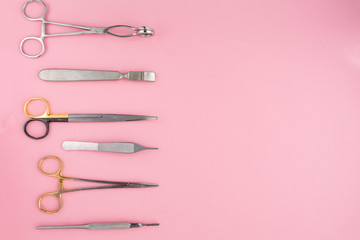 Flat lay of medical instruments on rose background. Mock up health care medical background.