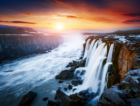 Rapid flow of water powerful Selfoss cascade. Unusual and gorgeous scene. Popular tourist attraction.