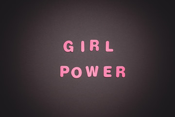 GIRL POWER writing on black paper background