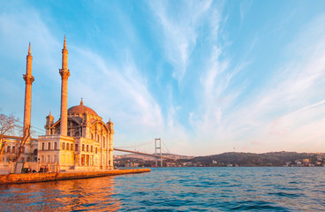 Obraz premium Ortakoy mosque and Bosphorus bridge at sunset, Istanbul, Turkey