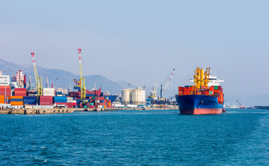 International Container Cargo ship in the port of genoa - Industrial port of genoa , italy
