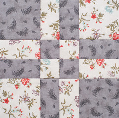 Fototapeta na wymiar Pastel geometric patchwork block from pieces of fabrics, detail of quilt