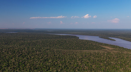 Fototapeta na wymiar Top view of the Iguazu waterfalls, parana river and huge rainforest spaces.