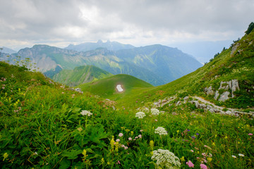 Naklejka na ściany i meble Typical summer mountains Switzerland landscape at sunny day time