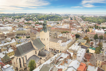 Fototapeta na wymiar Beautiful view of the Town Hall Tower, Adam Mickiewicz Square and the historical center of Lviv, Ukraine