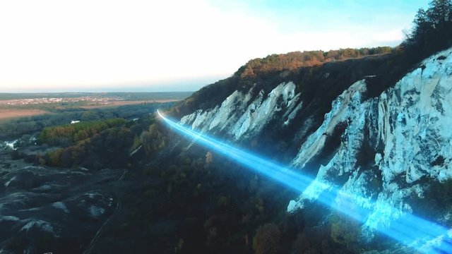 4k Aerial view The concept of disseminating information, data flows over a natural landscape with a river and mountains