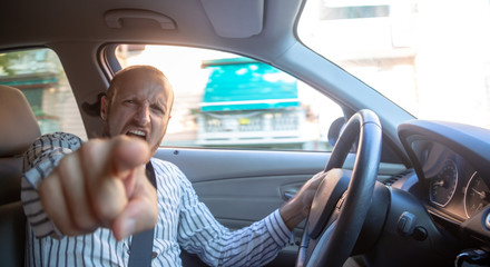 Aggressive and crazy driver in his car