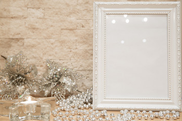 Christmas greeting card background, mock up. Glass star candlestick, glittering silver snowflaks on brick wall background. Copy space. Winter greeting.