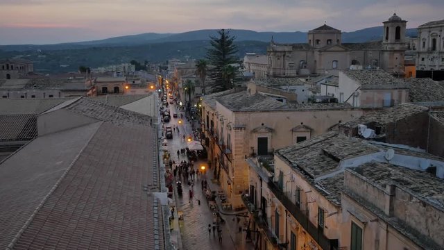 Architecture of Noto, Sicily -  Italy. Evening in the city full of tourists.