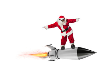 Fast delivery of Christmas gifts. Santa Claus ready to fly with a rocket isolated on white...