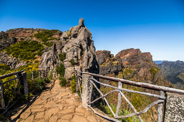 Fototapeta na wymiar Hiking trail passage from mountain Pico Arieiro to Pico Ruivo, Madeira. Madeira best island destination.
